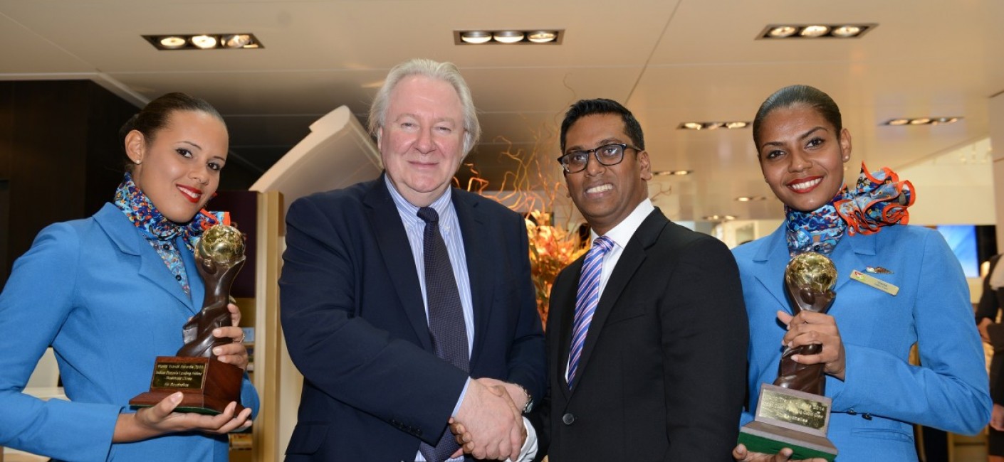 Manoj Papa, Air Seychelles’ Chief Executive Officer, is congratulated by Graham Cooke, President and Founder of the World Travel Awards, after being presented with trophies for best ‘Business Class’ and ‘Best Cabin Crew in the Indian Ocean’. On either side are Air Seychelles Cabin Crew, Vania Payet, on the left, and Laureen Loze