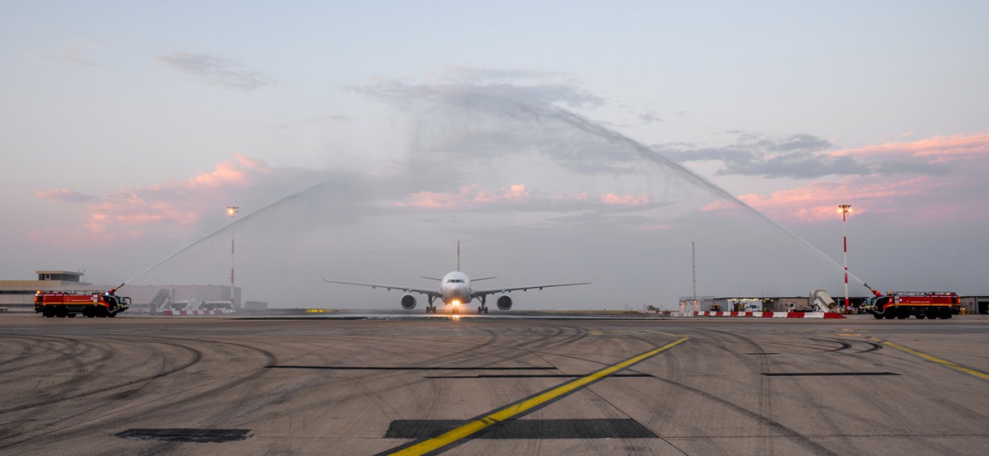 Flight HM16 is welcomed by a traditional water-cannon salute at Charles de Gaulle Airport